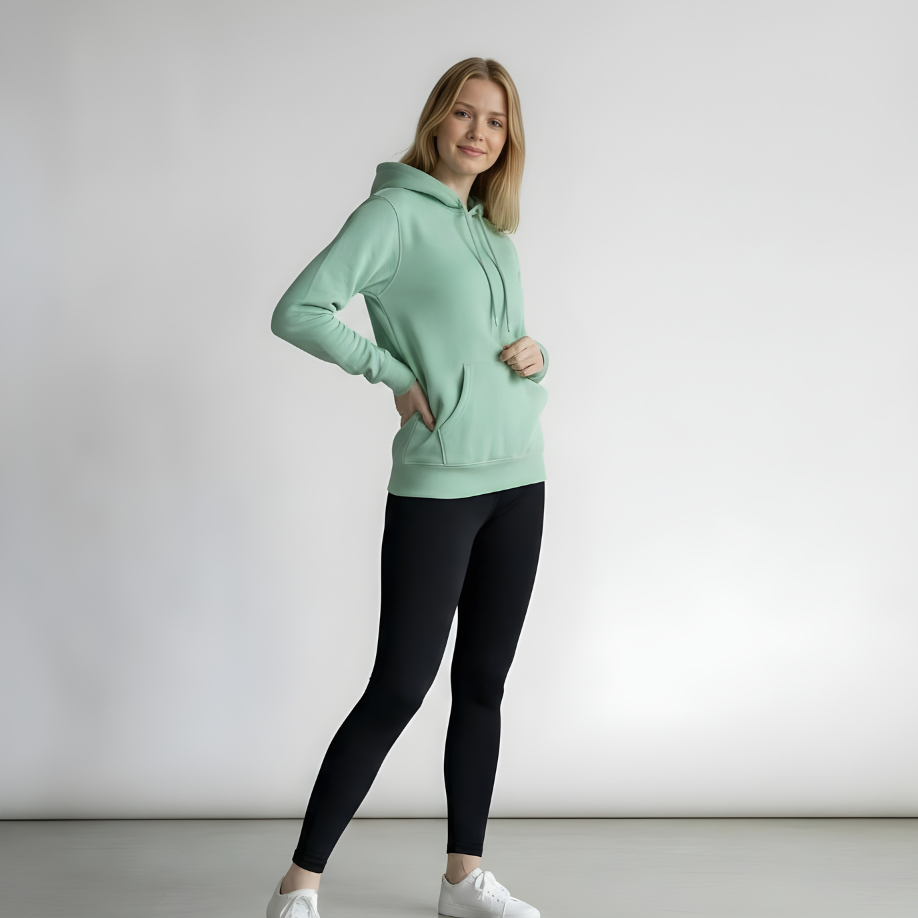 women wearing a hoodie and black leggings